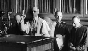 Pope Pius XII gives a blessing at the end of a radio message Sept. 1 ...