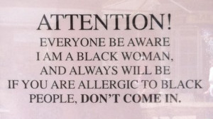 Sign which says 'attention, everyone be aware I am a black woman'