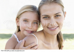 ... . Mother and daughter. Mother carrying her daughter on her back