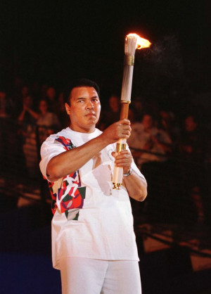 Muhammad Ali holds up the torch Muhammad Ali Quotes