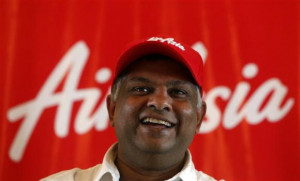 AirAsia Group CEO Tony Fernandes smiles during a news conference in ...