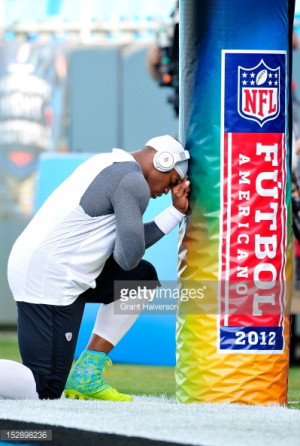 Cam Newton #1 of the Carolina Panthers kneels in prayer before a game ...