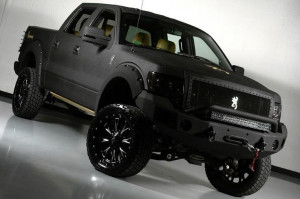 2012 Lifted matte black Ford truck. www.CustomTruckPartsInc.com is one ...