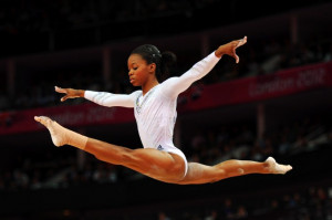 Gabby Douglas of the United States competes on the beam during the ...