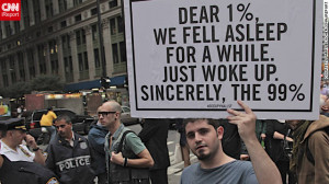 protester holds a sign at the Occupy Wall Street protest last ...