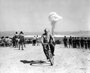 Albert Einstein riding around on a bike while something happens in the ...