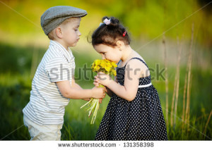 cute boy and girl on summer field