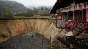 Sanica, Bosnia - Nov 2013. Village pond swallowed by sinkhole.