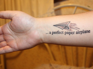 ... the quote saying a perfect airplace in this arm quote tattoo design