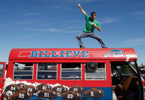 Neil Anderson, of Arcade, N.Y., poses on a bus during a tailgate party ...