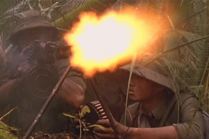 Here is Dugan firing away in the jungle with a M1911, probably a Colt: