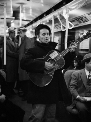 Woody Guthrie ridin' the subway. Transit troubador.