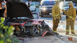 The red Porsche crashed into a lamp post in Valencia, north of Los ...