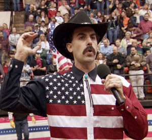 Stars and stripes now, tar and feathers later. Borat sings the ...