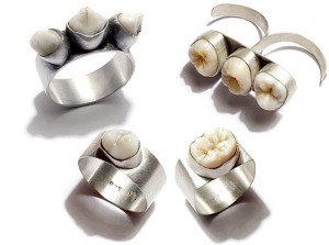 Above: Human teeth make an unusual addition to body jewelry. [source]