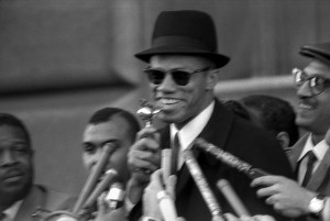 At a NYC rally, March 1964, just prior to his hajj experience