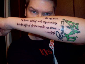 and writer both are mentioned in this forearm tattoo that also has a ...