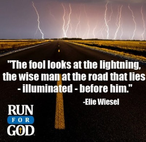 ... man at the road that lies - illuminated - before him.