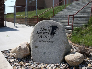 ... room and gunned down Aplington-Parkersburg football coach Ed Thomas