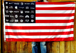American flag with the stars replaced by corporate logos