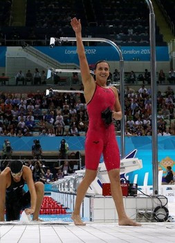 Rebecca Soni celebrates after breaking world record