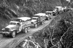Army trucks wind along the side of the mountainover the Ledo supply ...
