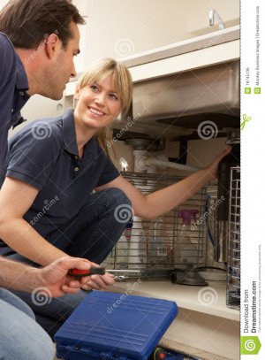 Royalty Free Stock Image Plumber Teaching Apprentice Fix Kitchen