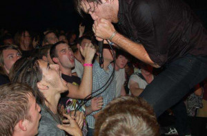 Oh, Sleeper vocalist Micah Kinard pumps the crowd up during the band's ...