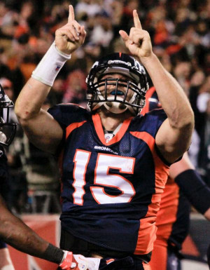 Denver Broncos quarterback Tim Tebow reacts after scoring a touchdown ...