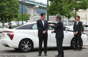 Shinzo Abe left speaking with Toyota chairman Takeshi Uchiyamada