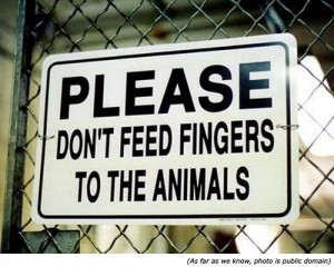 ... warning sign and zoo signs: Please, don't feed fingers to the animals