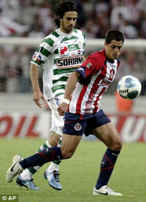Earning his stripes: Javier Hernandez (right) lines up for Guadalajara ...