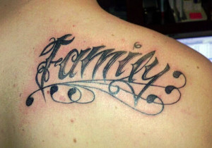 love for his family through a lettering tattoo carved in cursive font ...