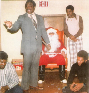 Harold McLinton (Santa Claus) and L-R Santa's Helpers Dave Robinson ...