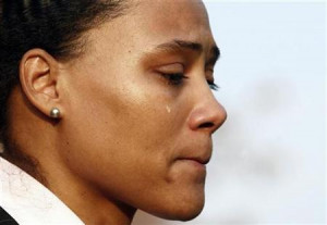 Marion Jones cries as she makes a statement to the media after leaving ...