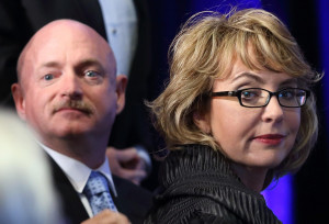 Gabrielle Giffords and Mark Kelly, seen in May 2013, are writing a ...