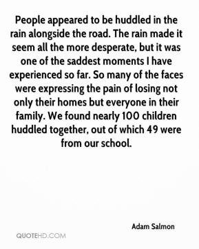 Adam Salmon - People appeared to be huddled in the rain alongside the ...