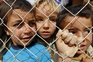 Syrian refugee children watch Martin Keown, a former British soccer ...