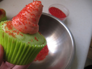 Begin by creating the Santa hat using a large round decorating tip ...