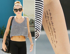 Miley Cyrus debuts her new tattoo yesterday while in West Hollywood.