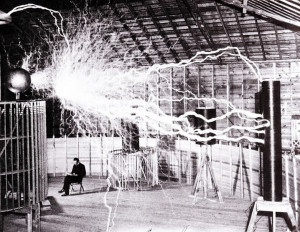 Publicity photo of Nikola Tesla sitting in his laboratory in Colorado ...