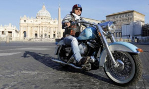 biker parks his motorcycle in front of St. Peter's square during the ...
