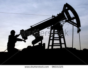 . 31: A roughneck maintains a nodding donkey at a producing oil field ...