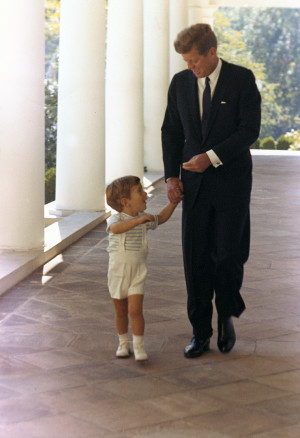 President Kennedy and his son John F. Kennedy Jr. walk hand-in-hand ...