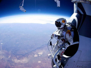 Felix Baumgartner stands on the edge of his capsule, ready to skydive ...