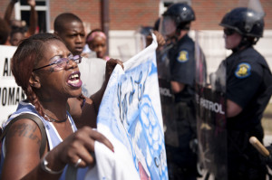 Marcelle Stewart confronts police officers during a march and rally in ...