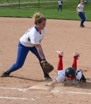 BNL’s Cassidy Morron dives back into first base. Morron had two hits ...