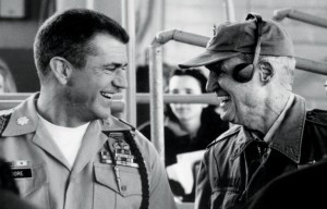 Mel Gibson and Hal Moore share a laugh on the set of 