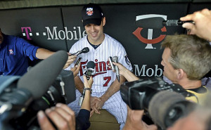 Twins catcher Joe Mauer speaks to the media about his twin girls and ...