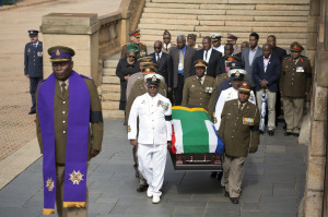 Military personnel carry the remains of the late Nelson Mandela at the ...